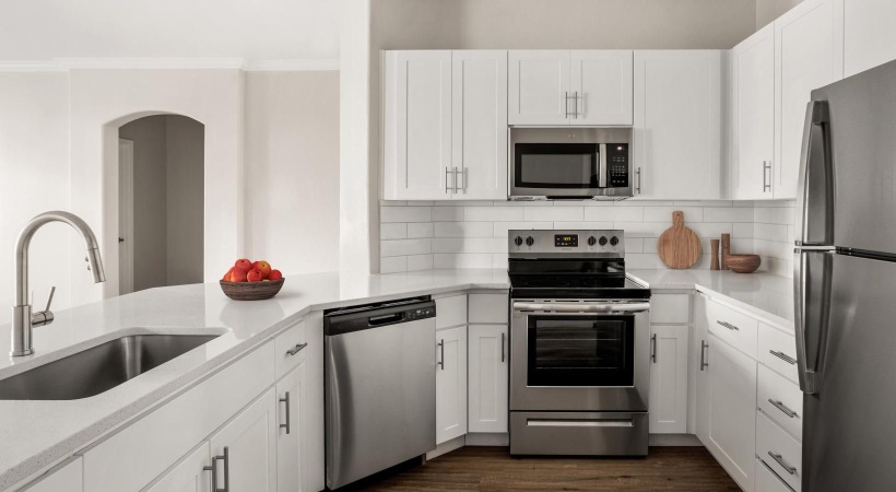a kitchen with white cabinets