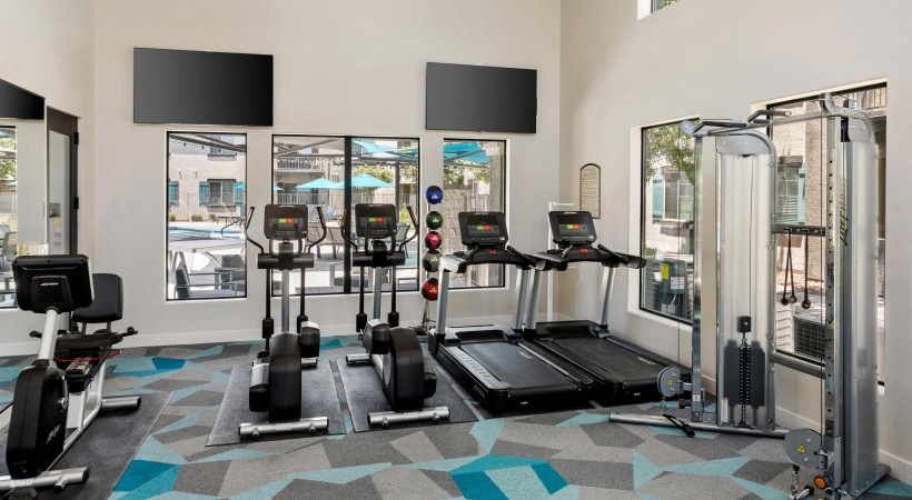 a room with treadmills and treadmills