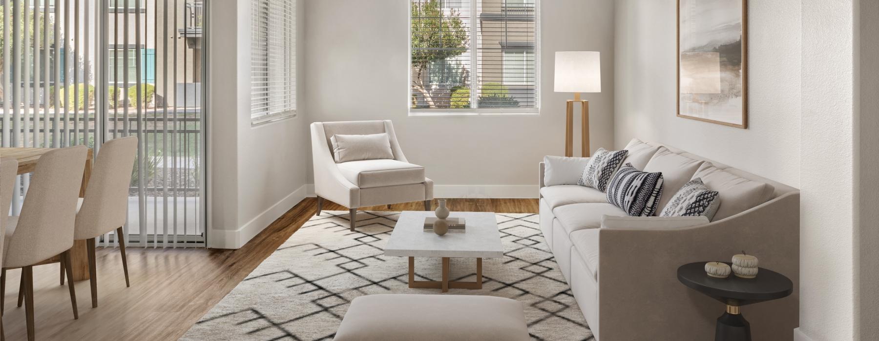 a living room with a couch and chairs